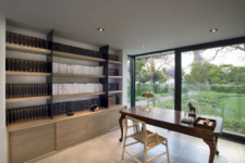 06 The home office features an elegant desk, large shelves and a sleek storage unit plus a glazed wall