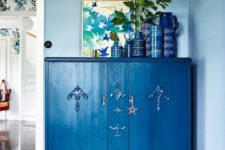 07 a refined vintage dresser painted classic blue and accented with a star plus blue pottery on top for an edgy touch
