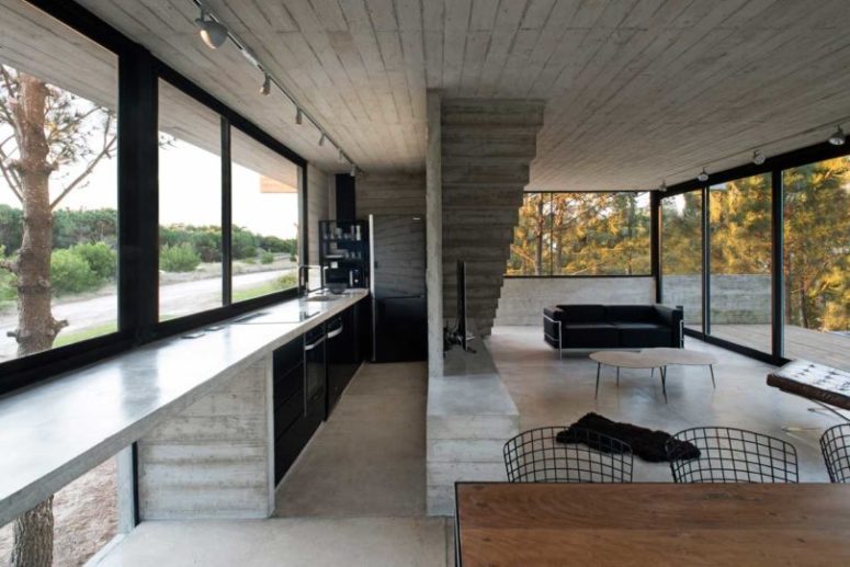 The kitchen is long and narrow, with built in furniture and appliances plus a window instead of a backsplash The kitchen is long and narrow, with built-in furniture and appliances plus a window instead of a backsplash