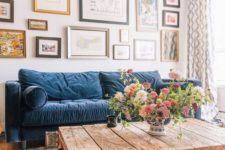 09 a modern farmhouse living room with a classic blue sofa that adds color and an edgy touch to the space