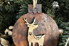 09 a wooden Christmas ornament with rust decor and a little wooden deer on it is super cute and nice