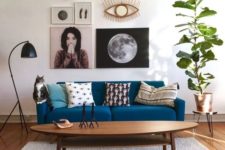 10 a monochromatic space with a classic blue sofa that adds color and a bright and fashionable touch to the space