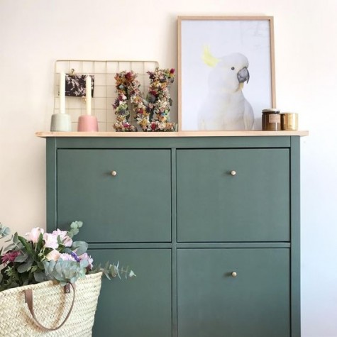 a dark green IKEA Hemnes shoe cabinet hack with a wooden countertop is a stylish idea for a modern home