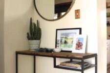 14 a simple and stylish entryway console of an IKEA Vittsjo desk that got a wooden tabletop for a more rustic look
