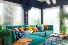 23 a colorful and fun living room with bright furniture, rugs, an artwork and lots of pillows