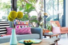 25 a colorful living room with bright furniture, rugs and pillows and porcelain