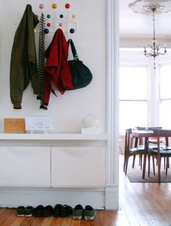 IKEA Trones storage boxes and a tabletop attached over them for a minimalist entryway