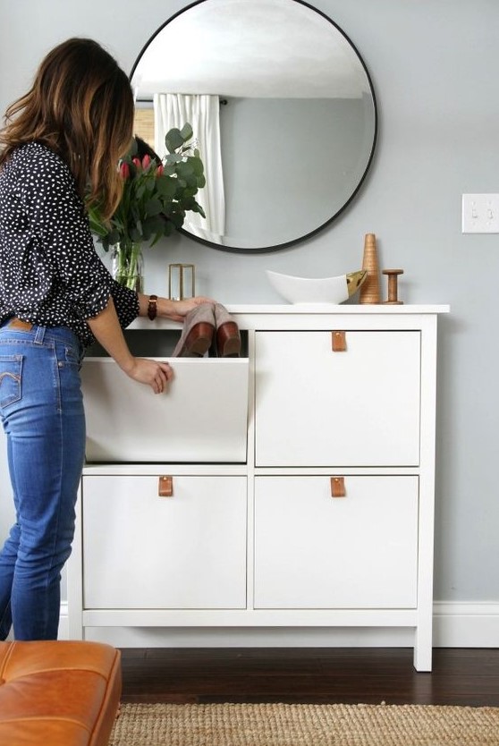 a chic and simple IKEA Hemnes cabinet hack with leather pulls is a cool way to spruce up a simple storage piece