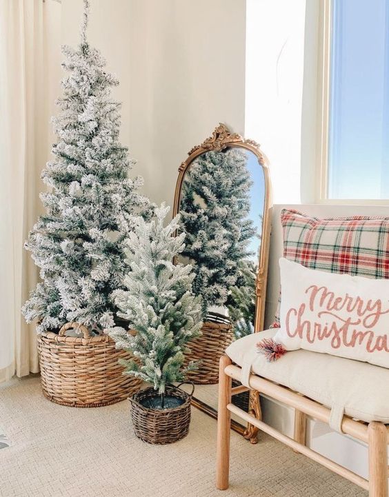 a duo of flocked Christmas trees in baskets is a cool decoration for the holidays and will cozy up any space
