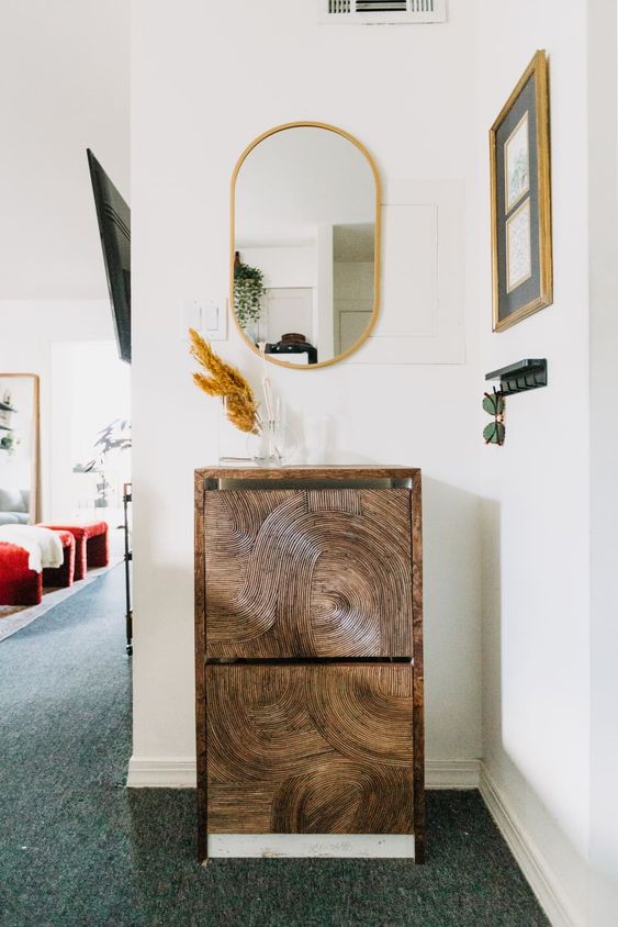 a super cool Bissa cabinet redone with catchy adhesive paper is a unique solution for a boho or modern entryway