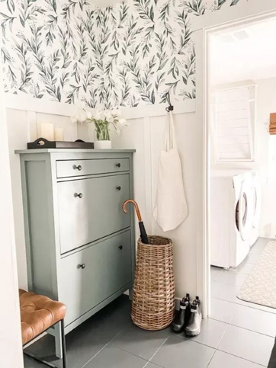 an IKEA Hemnes shoe cabinet done in olive green with small black knobs is a cool idea for a modern farmhouse space