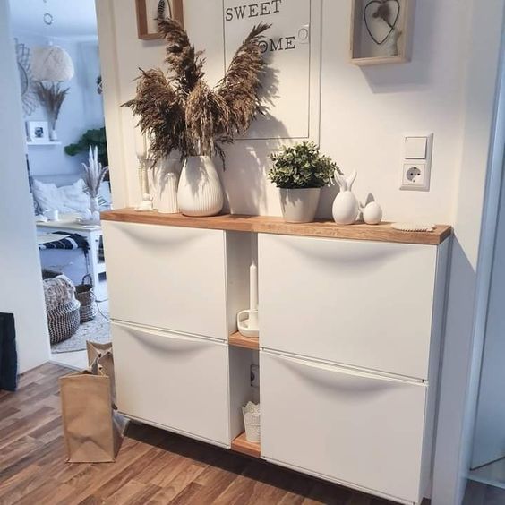 an IKEA Trones hack with additional shelves between the pieces and a common stained countertop is a lovely idea for a boho space
