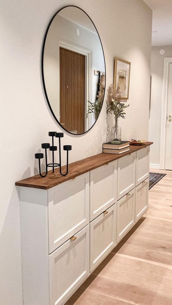 an IKEA shoe cabinet makeover with shaker style compartments, gold handles and a stained countertop