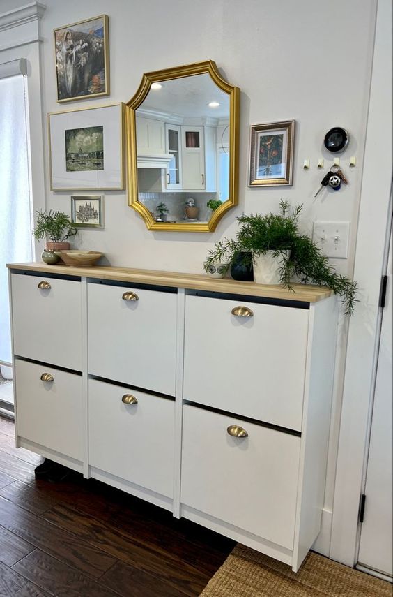 an elegant IKEA Bissa cabinet with a butcherblock countertop and gold knobs is a lovely idea