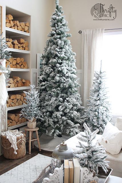 multiple flocked Christmas trees with no decor and no lights are amazing for cozy farmhouse decor