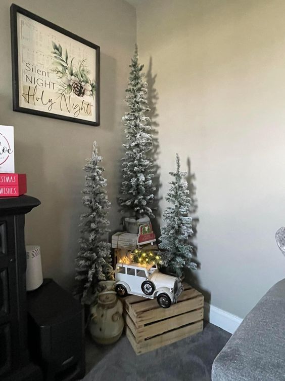 multiple small Christmas trees with some vintage toys are great to style a vintage space or a kids' room for holidays
