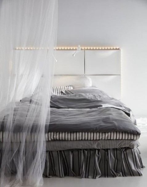 use IKEA Trones to create a comfy headboard with storage and lights, ideal for a contemporary space