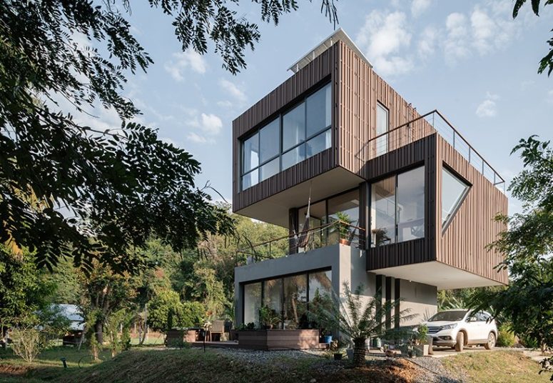 This contemporary home in rural Thailand is composed of three sculptural volumes that are stacked on each other This contemporary home in rural Thailand is composed of three sculptural volumes that are stacked on each other