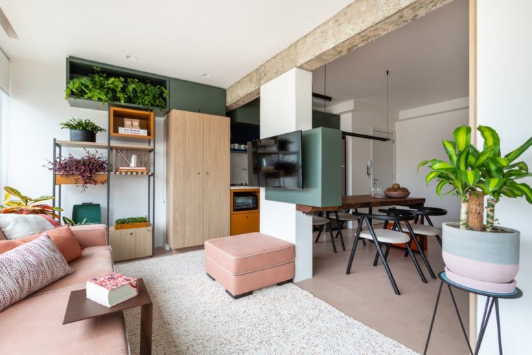 This small apartment features no inner walls but every zone is separated from the others with some smart solutions