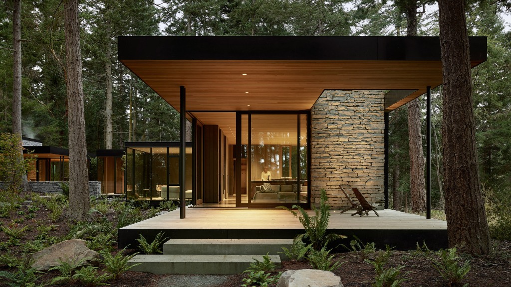 This stylish and contemporary dwelling consists of several volumes and looks very connected to nature