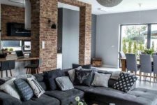 02 a contemporary meets industrial living room with a grey laminate floor and furniture on legs