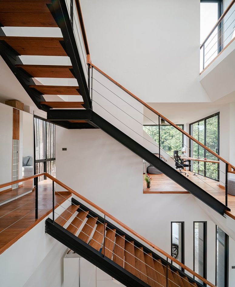 Inside, the interiors are inviting and clean, there are no unnecessary details, white walls, rich colored wood and black touches Inside, the interiors are inviting and clean, there are no unnecessary details, white walls, rich-colored wood and black touches