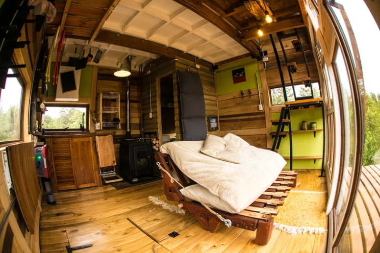 hidden storage is a must for a cabin The interior of the cabin is super simple and very modest - there's a hearth, a bed, some shelves and stairs and some hidden storage and furniture