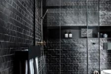 03 a contemporary bathroom with black tile walls and white grout plus a wooden ceiling