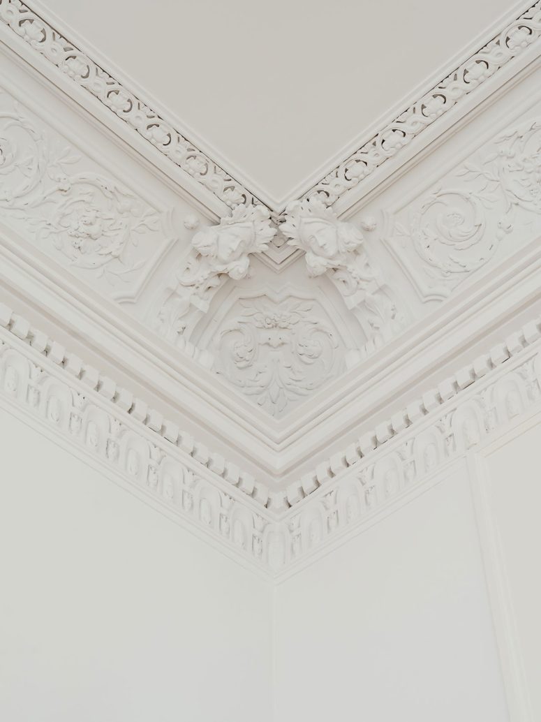 Moldings and other decor touches were retained and painted to add chic and elegance to the apartment Moldings and other decor touches were retained and painted to add chic and elegance to the apartment