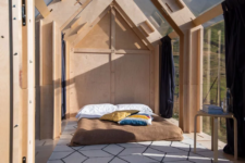 05 The interior is minimal and includes a matress and a side table plus curtains