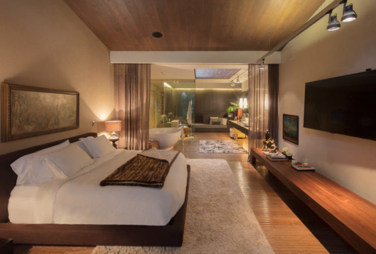 The master bedroom is done in earthy neutrals to make it warm and wlecoming, there is much upholstery and a cozy bed The master bedroom is done in earthy neutrals to make it warm and wlecoming, there is much upholstery and a cozy bed