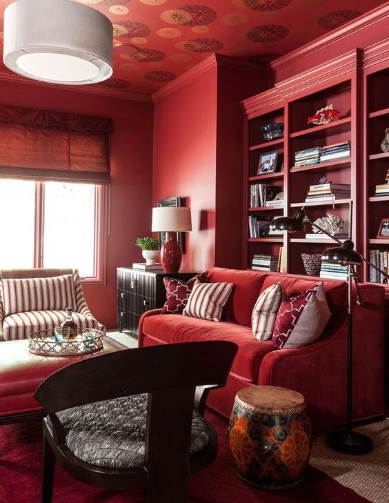 09 A Monochromatic Bold Red Living Room With Built In Shelves Comfy Furniture And Some Dark Touches For Drama 