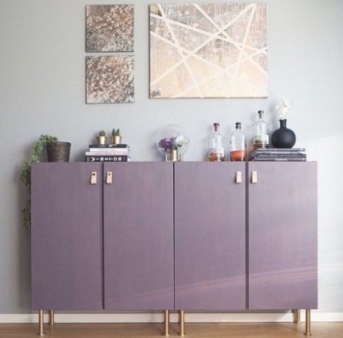 plain Ivar cabinets turned into a stylish home bar in purple, with copper legs and leather pulls