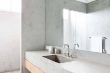 12 a concrete bathroom with all surfaces concrete is a trendy and simple idea for a modern space