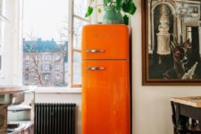 16 try a bright orange fridge to bring a fun and colorful touch to your kitchen and renovate it at once