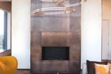 20 a fireplace highlighted with copper panels for safety and a bold modern look