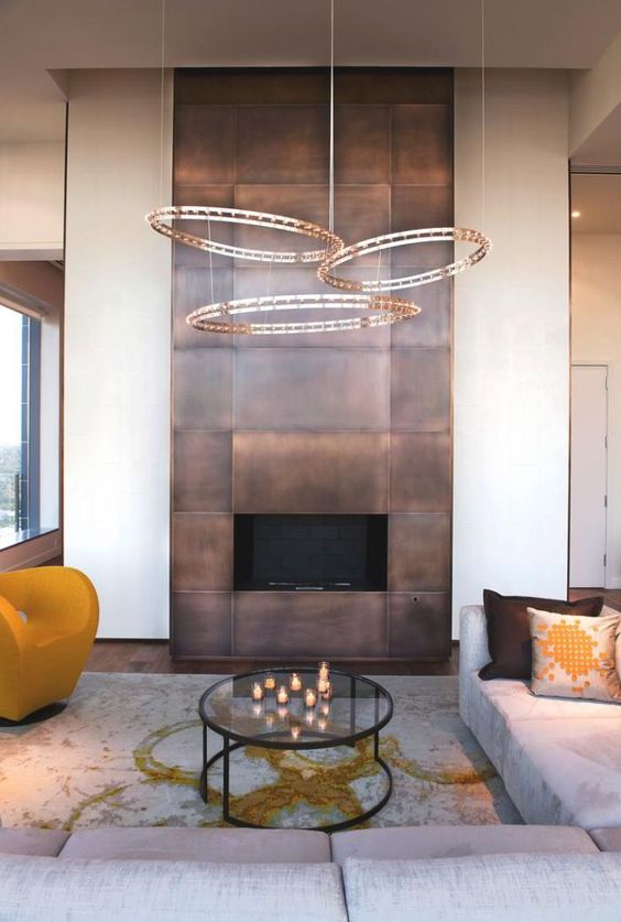 a fireplace highlighted with copper panels for safety and a bold modern look