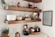 20 thick open shelves match the kitchen cabinets and look statement-like