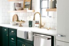 22 a forest green and white kitchen spruced up with gold touches and thick open shelving and Roman shades