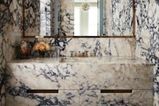 22 such unique marble on the walls and on the vanity will make your bathroom stand out a lot