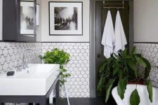 33 partially tiled walls with black grout that accents the tiles a lot and makes them cooler and bolder