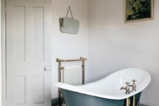 40 a vintage bathroom in neutrals spruced up with brass fixtures here and there and an elegant chandelier