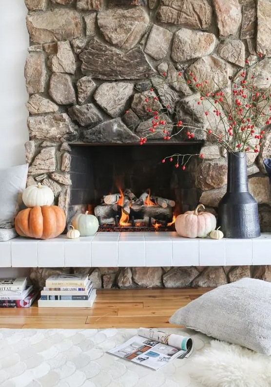 a gorgeous fireplace clad with natural stone looks cool, bold and textural and is sure to attract attention