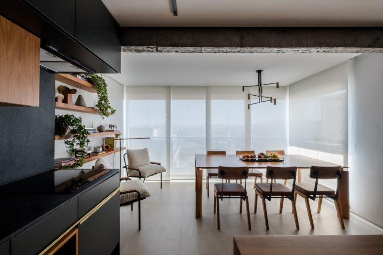 This contemporary and not very large Brazilian apartment is a second home for a family from Israel and it features cool views