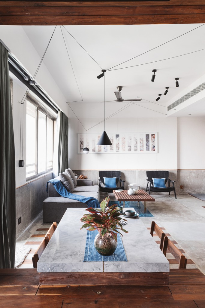 This contemporary apartment is fully open plan and is done with a simple color palette and blue accents This contemporary apartment is fully open plan and is done with a simple color palette and blue accents