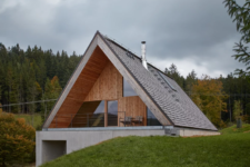 01 This contemporary weekend house in Beskydy mountains was inspired by traditional cabin retreats and features a creative approach to the landscape