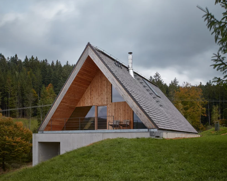 This contemporary weekend house in Beskydy mountains was inspired by traditional cabin retreats and features a creative approach to the landscape