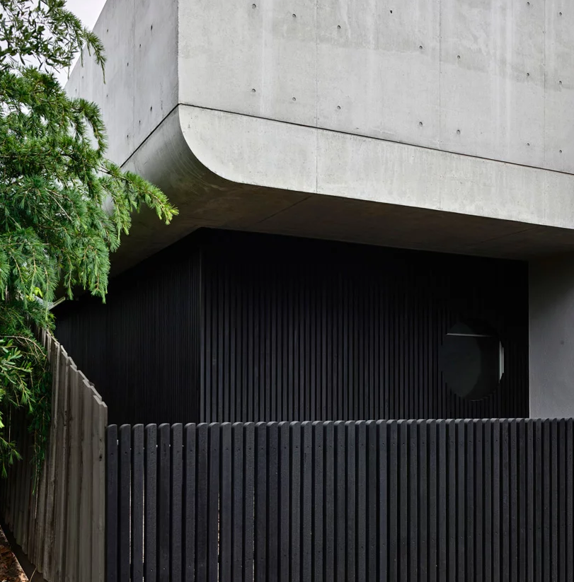 This home is a renovation of a Victorian house done with concret and curved shapes and lines