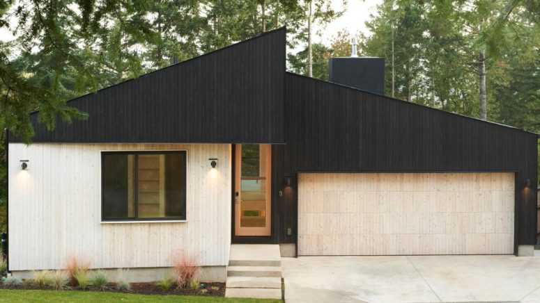 This minimalist home in Washington is covered with two tone wood to make its look contrasting and outstanding from the traditional neighborhood This minimalist home in Washington is covered with two tone wood to make its look contrasting and outstanding from the traditional neighborhood