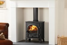 03 highlight your wood burning stove placing it into a niche with a concrete floor